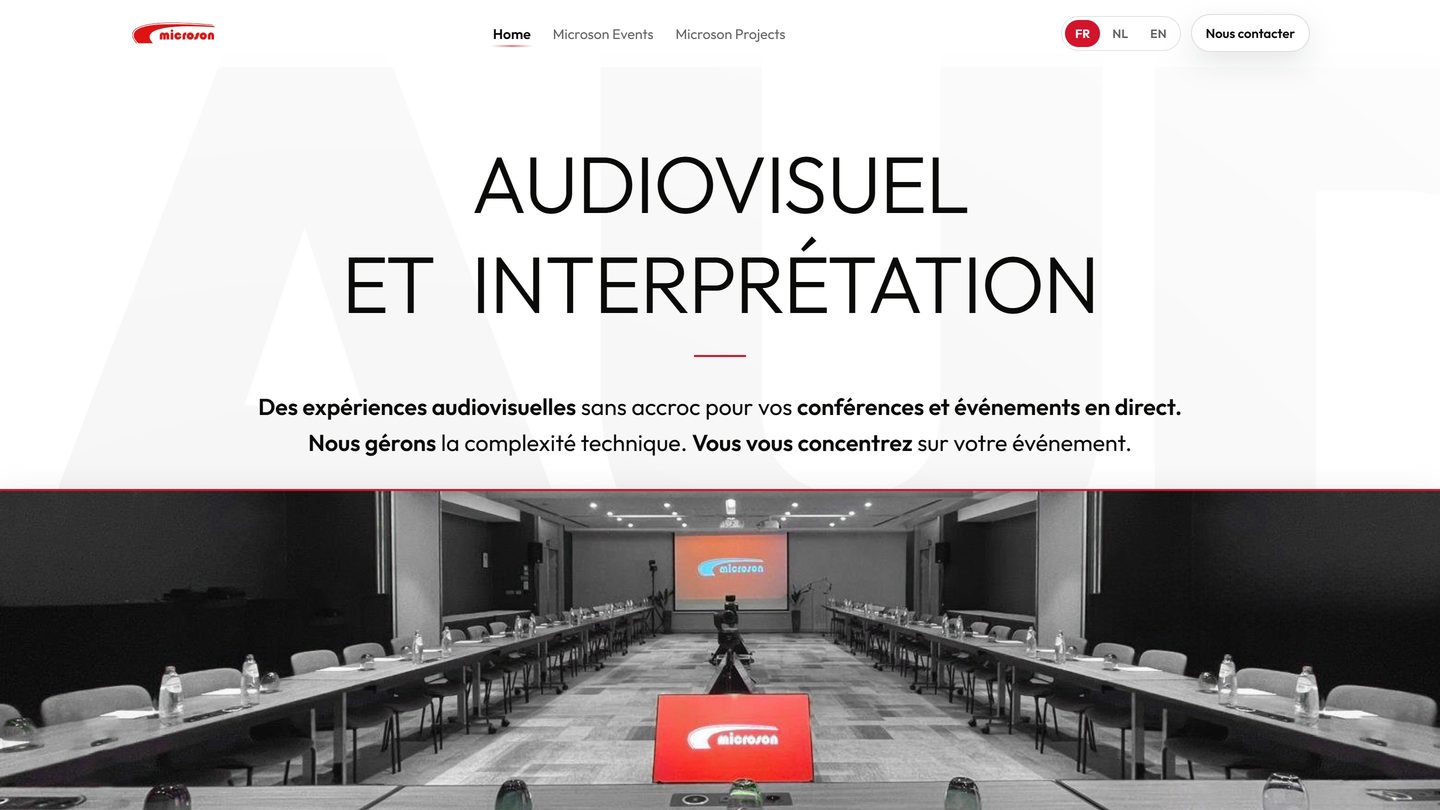 Microson website home page: “Audiovisual and interpreting”, above a fully equipped conference room